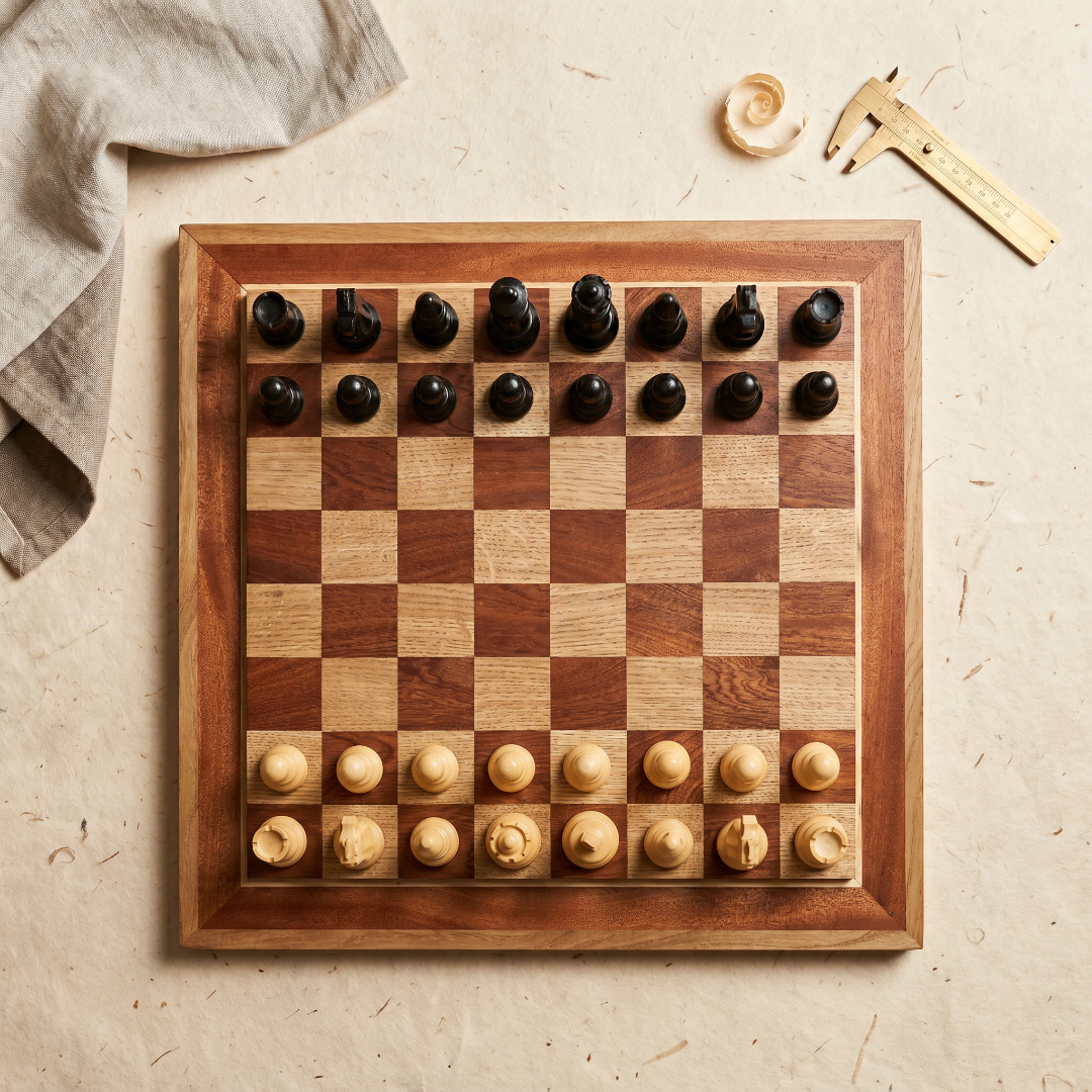 Flat lay view of a Dechamel chess board with workshop tools